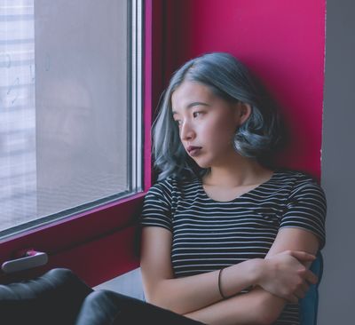 woman looking out the window