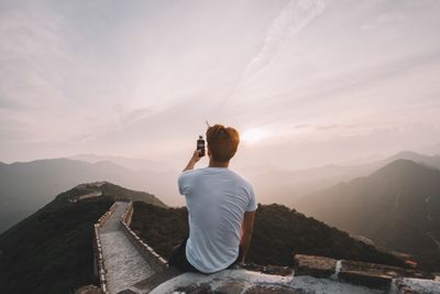 sitting on wall